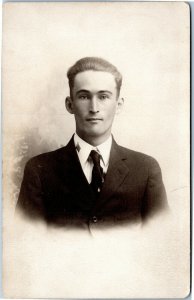 rppc postcard Male portrait USA flag on collar Ernest McNitt  AZO 1904-1918