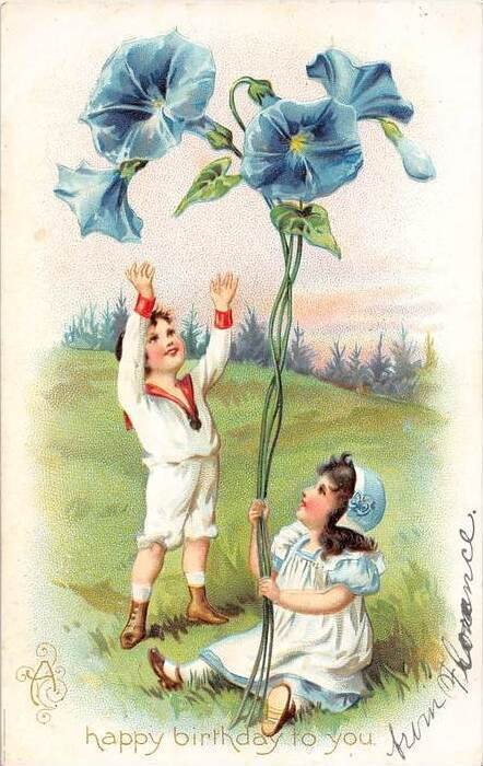 Birthday , A boy and Girl holding giant blue flower