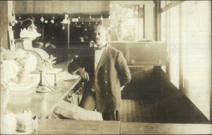 Black Americana Well-Dressed Man at Counter Hotel or Restaurant Worker? RPPC