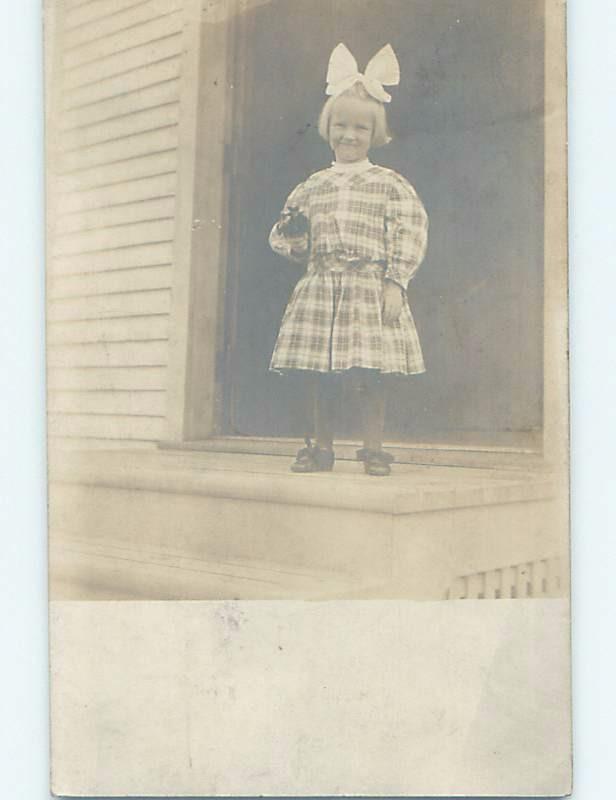 Pre-1920's rppc CUTE GIRL IN PLAID CHECKERED DRESS WITH BOW IN HAIR HM0651