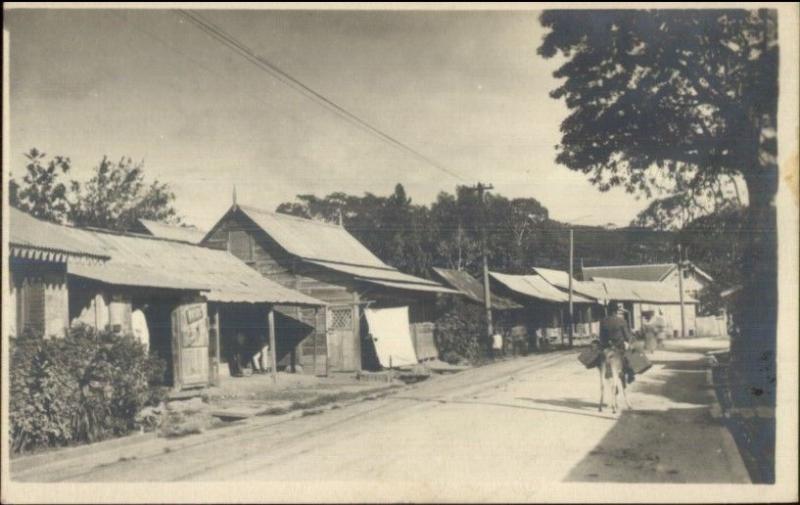 Jamaica Panama or Virgin Islands? Shacks Homes Dirt Road c1915 RPPC myn