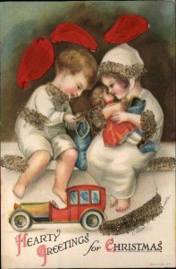 Christmas Children Stocking Doll Glitter Ribbon Ellen Clapsaddle c1915 Postcard