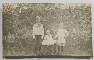 Rppc Three Nicely Dressed Children Posing in the Garden for Photo Postcard R7