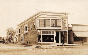 H24/ Cedar Springs Michigan RPPC Postcard c1910 Ackley Block Stores77