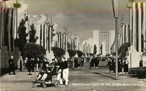 1939 RPPC Golden Gate Expo Pacifica, Court of Seven Seas Moulin 53 Women in Cart