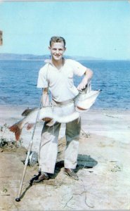 MANIWAKI,  Quebec, Canada   Young Man with GIANT PIKE FISH  1956    Postcard