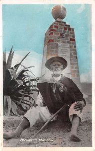 Quito Ecuador Man Smoking by Equator Monument Tinted Real Photo PC AA109279