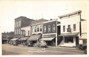 Plainwell MI Storefronts Street Old Cars RPPC Postcard