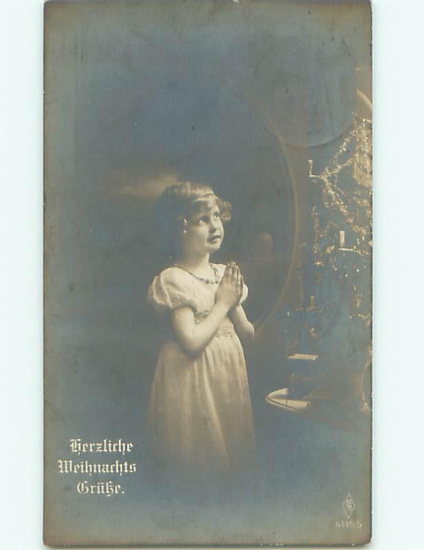 rppc 1919 GERMAN GIRL PRAYING BY THE CHRISTMAS TREE AC8271