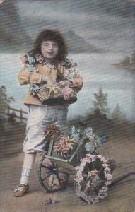 Young Boy With Basket and Cart Of Flowers