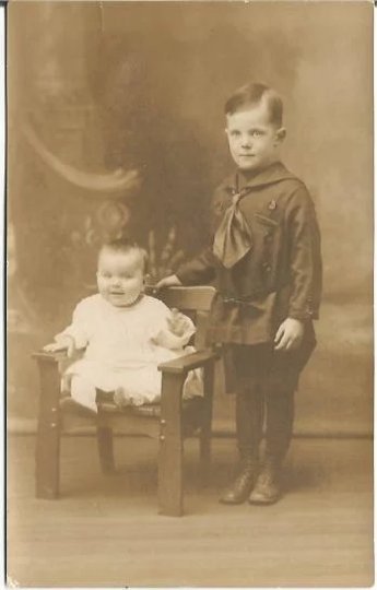 Little Boy with Baby Brother in little wooden chair in Sienna/Sepia Family Photo