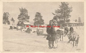 Finland, Lappi, Lapland, Suomi, Man in Native Ethnic Costume with Reindeer