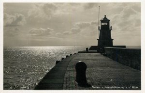 Sailing & navigation themed postcard Emden Abendstimmung lighthouse