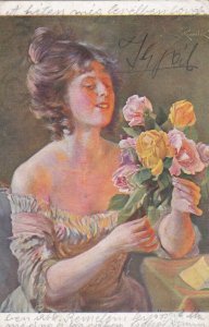 AS: Woman wearing strapless dress admiring roses, 1900-10s