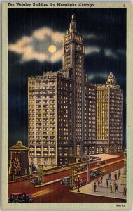 VINTAGE POSTCARD THE WRIGLEY BUILDING AND STREET SCENE UNDER MOONLIGHT c. 1930s