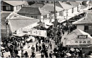 RPPC  OKINAWA?, JAPAN  Busy STREET SCENE from above, COKE Sign  c1950s  Postcard