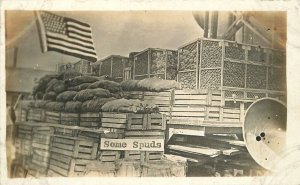 Postcard RPPC C-1910 Farm agriculture Potato Display Patriotic Flag 23-1632