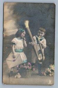 KIDS PLAYING MUSIC ANTIQUE REAL PHOTO POSTCARD RPPC RUSSIAN WRITING TALLIN sent