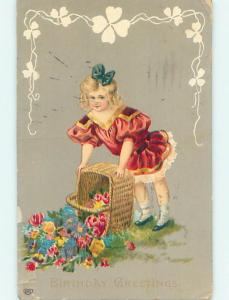 1916 CUTE GIRL DUMPS FLOWERS FROM A WICKER BASKET o9469