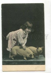 401718 Girl playing w/ PIGS Vintage RPPC Finland Russia PC