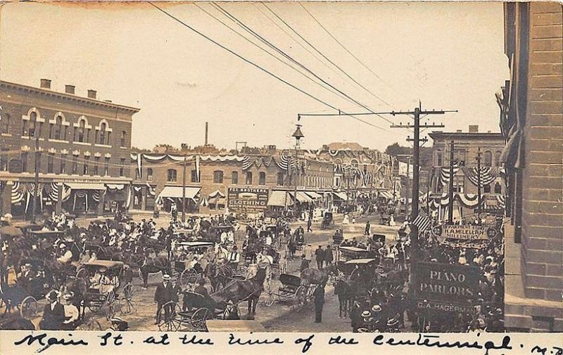 Houlton ME Busy Street  Store Fronts Piano Parlors Fox Clothing RPPC Postcard