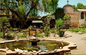 California Mission San Juan Capistrano The Famous White Pigeons and Front Gar...