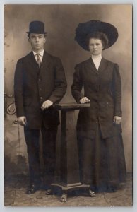 RPPC Dapper Man Bowler Hat Woman Large Brim Hat Studio Photo Postcard U28