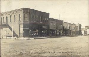 Rockwell IA Main St. Signs Visible in Store Windows c1910 Real Photo Postcard