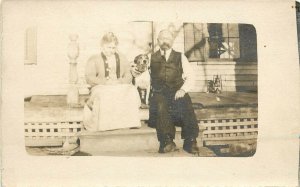 c1910 RPPC Postcard Nice Old Couple on Porch w/ their Beagle type Dog Unknown US