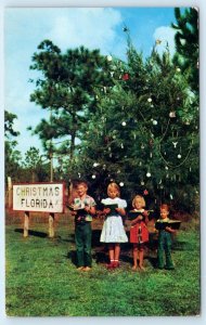 CHRISTMAS, Florida FL ~ Xmas Tree CHILDREN SINGING c1950s Orange County Postcard