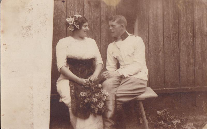 Social history a military man idyl with a peasant girl in folk costume RPPC