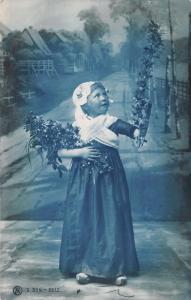 Little Girl in Dutch Dress Holding Flowers & Wearing Wooden Shoes~Vintage RPPC