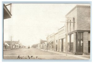 c1910's View Of Main Street Corner Shop Business RPPC Unposted Photo Postcard