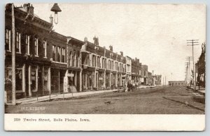 Belle Plaine IA~Hanging Light on Dirt Main (12th) St~Bldgs Mostly Gone~1907 