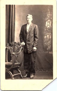 RPPC Handsome Young Man w/ Ornate Studio Chair Corbett Warren c1918