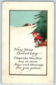 1917 New Year Greeting Boy Sitting Sled On Winter Scene Embossed Posted Postcard