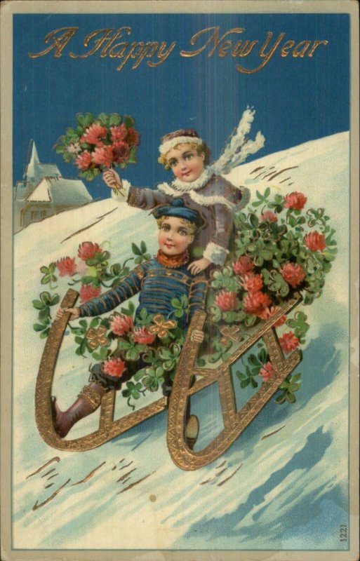 New Year - Children Sledding w/ Flowers Gold Sled c1910 Postcard