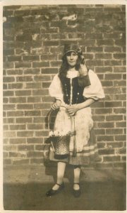 Postcard RPPC C-1910 Europe Ethic Dress woman flower basket 23-6957