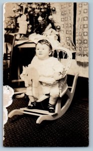 1915 Christmas Rocking Horse Toy Cute Baby RPPC Photo Posted Antique Postcard