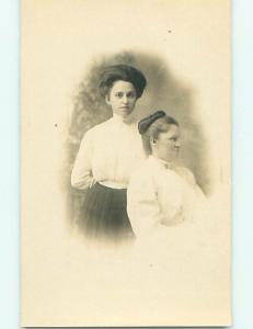Pre-1918 rppc TWO WOMEN WITH ONE TURNED TO THE SIDE r5847