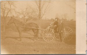 RPPC Man with wife and mother-in law in horse-drawn cart