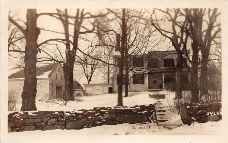 New Hampshire  House and garage behind rock wall