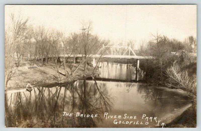 Goldfield Iowa~Riverside Park Bridge~Picnic Table on Boone River~Boat~1908 RPPC 