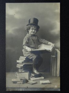 Child / Top Hat & Specs Reading whilst sitting on a pile of books c1911 Postcard 