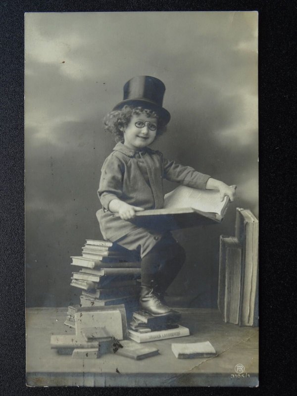 Child / Top Hat & Specs Reading whilst sitting on a pile of books c1911 Postcard 