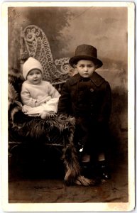 Two Young Children in Winter Wool Clothes Pose for Portrait - Vintage Postcard