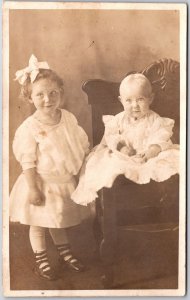 Kids Siblings Toddler and a Baby in Wooden Chair Photograph Postcard