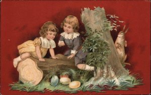 Easter Cute Kids Boy and Girl Find Easter Eggs c1910 Vintage Postcard