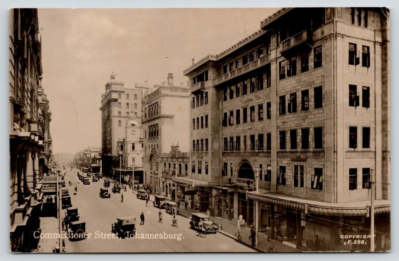 Johannesburg ZA~Commissioner Street~Hughes Gents Outfitters~1920s Cars~RPPC 