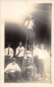 J37/ Interesting RPPC Postcard c1910 People Eating Watermelon Ladder 14